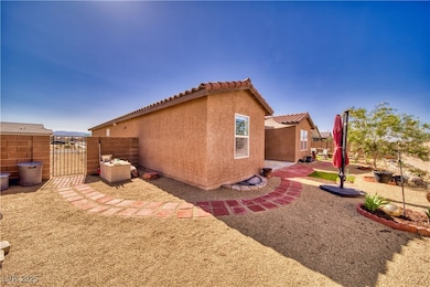 View of property exterior with a gate, stucco sidi