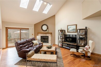 Notice the unique tiled fireplace.  Lots of light