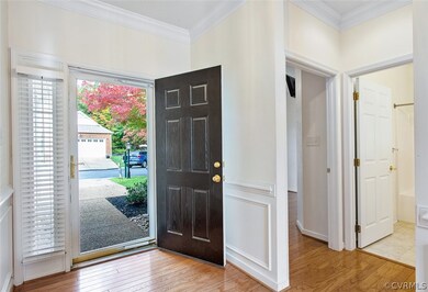 Foyer with view of front yard, bedroom 2 and hall