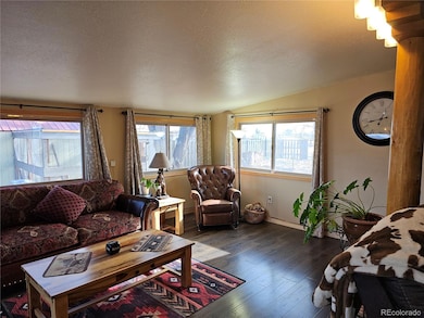 Family Room with excellent lighting from the East.  Chicken coop just outside in back.