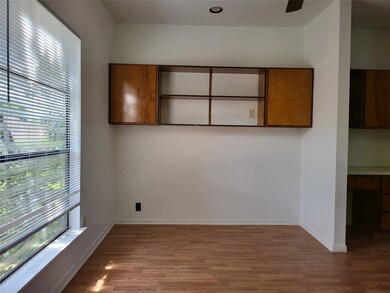 living area w/built-in book shelves & cabinets