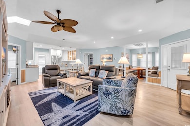 Living room featuring light hardwood / wood-style 