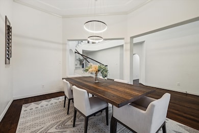 The elegant formal dining room provides a sophisticated setting with generous space to comfortably host large dinner parties, holiday gatherings, or intimate celebrations.