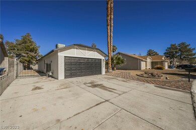 Oversized side gate with large driveway.