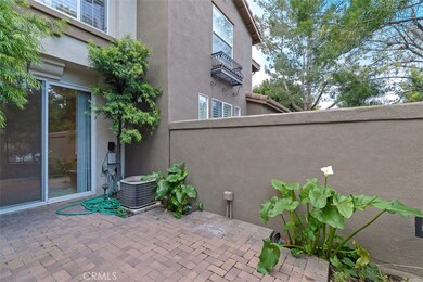 Perfect for container gardening, a view of the front patio with direct access to the junior master downstairs with private bath.