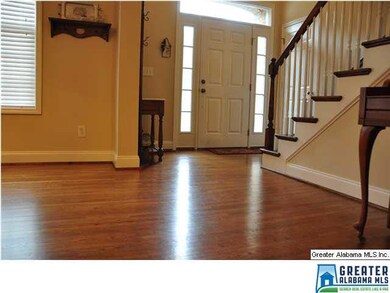 Open foyer with hardwood floor