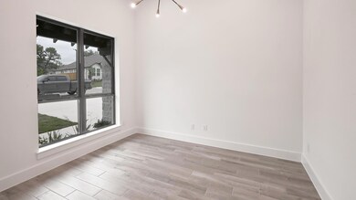Empty room with an inviting chandelier, baseboard