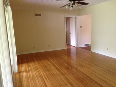 Toward bedrooms and sliding door to porch at left