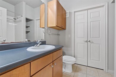 Bathroom with a shower, tile patterned floors, va