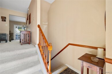 Staircase featuring carpet