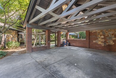 Carport with wooden gable.