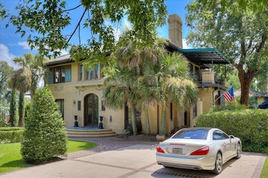Front brick lined concrete driveway