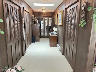 Hallway adjoining living room area and dining room