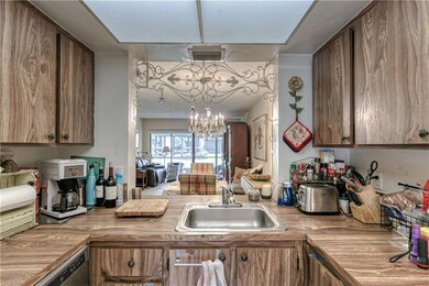 Kitchen offers wood cabinets and countertops and o