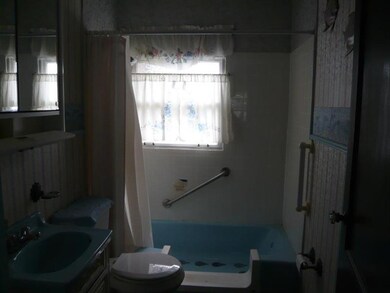 Full bath in back hall.