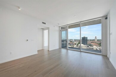 Empty room featuring visible vents, baseboards, a