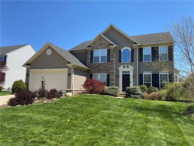 brick and vinyl bumped out garage