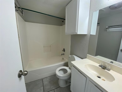 This view is of the bathroom. Notice the combinati