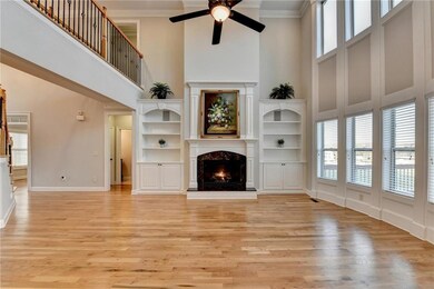 Unfurnished living room featuring crown molding, l