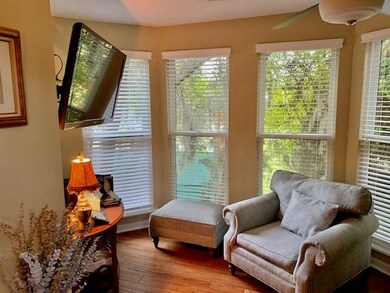 Enclosed porch creates a sweet tv or reading nook