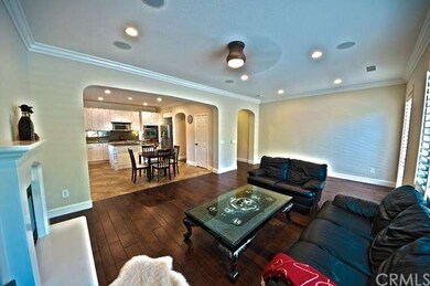 Family room features stunning hardwood floors, rec