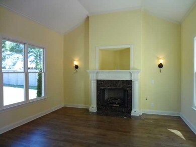 Bright hearth room overlooks courtyard and back ya