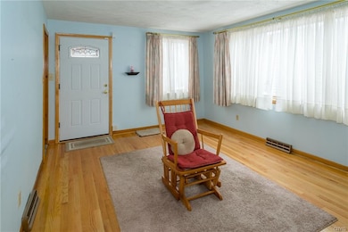 The living room is large and comfortable, with ple