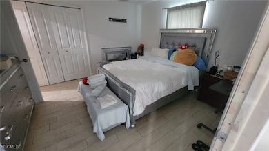 Bedroom featuring a closet and light wood finished floors