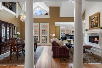 Living area with wood finished floors, a high ceil