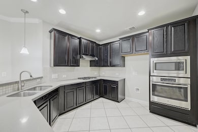 Kitchen featuring a sink, stainless steel applian