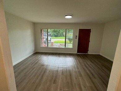 Spare room featuring dark hardwood / wood-style fl