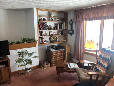 Living room has built in shelves! Hardwoods under