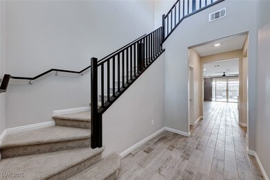 Staircase with recessed lighting, wood finished fl