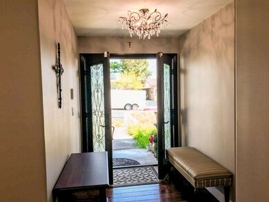 Look up and see the beautiful entry chandelier!