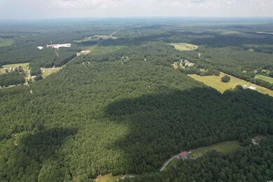 Birds eye view of property featuring a rural view