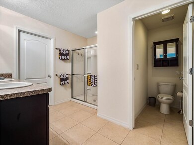 Master bathroom with dual vanity, walk-in shower a