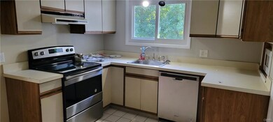 Kitchen with new stove and Dishwasher