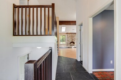 Hallway featuring dark hardwood / wood-style floor