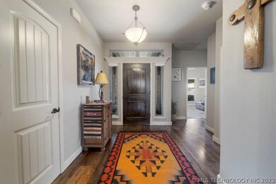 Entry looking back toward front door with side lig