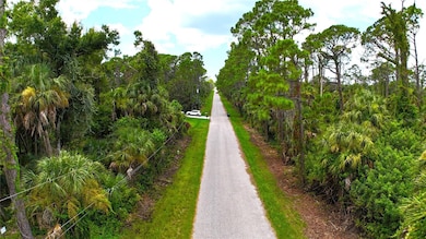 Street view to the west.  Lot is on the right.