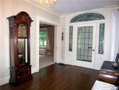 Foyer. Foyer entrance with leaded fan and sideligh