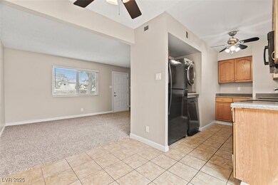 Kitchen featuring light tile patterned flooring, l