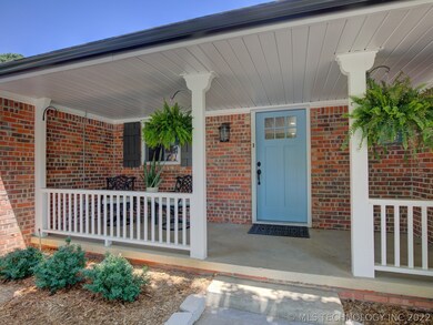 Covered front porch and new front door.