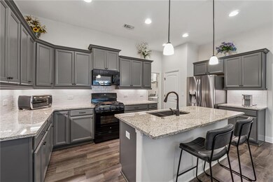 Gas Stove, Tall Cabinets, Ample Counterspace