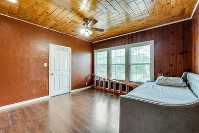 Bedroom with wooden walls, wooden ceiling, ceiling