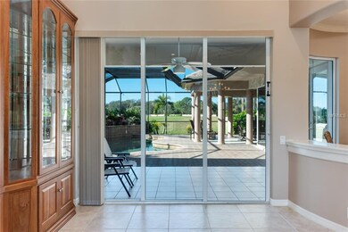 Living room with sliders to lanai and pool