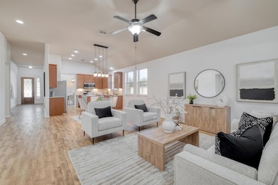 Living area with light wood finished floors, vaul