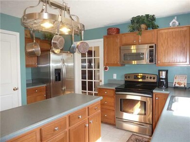 Kitchen. Nice Stainless Appliances, Lighted Pan Rack Stays, Center Island All Overlooking The Private Backyard!