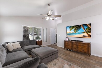 Living Room w/ new impact windows, luxury vinyl flooring, and a coat closet
