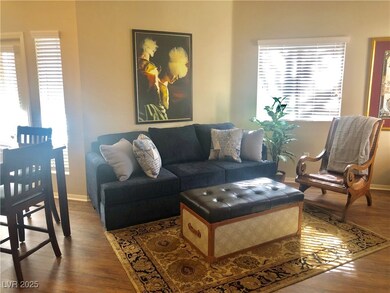 NO CARPET IN THIS LIGHT AND BRIGHT UNIT WITH COVERED BALCONY AND 2 CAR ATTACHED GARAGE.